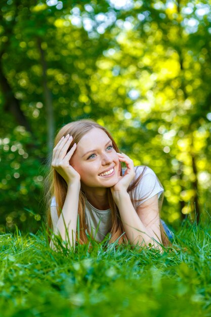 Beautiful smiling red-haired young woman