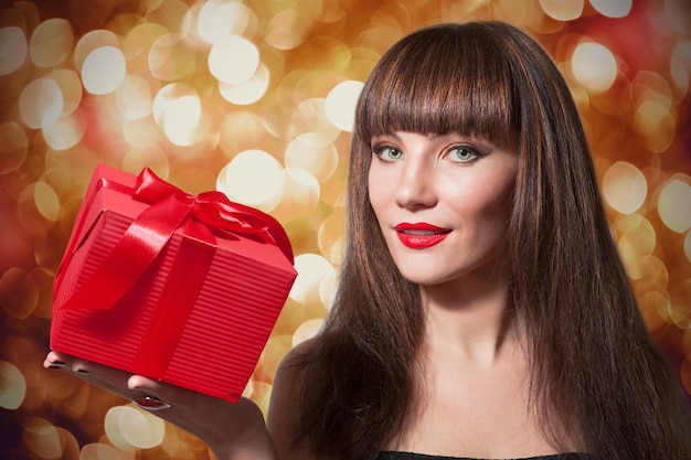 Beautiful Smiling Woman, Brown Straight Long Hair with Red Gift Box, shiny boke background