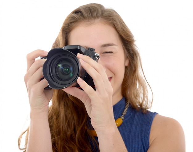 Beautiful smiling woman with digital camera, on white