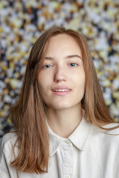 Beautiful smiling young woman with perfect skin face natural beauty concept isolated on studio background