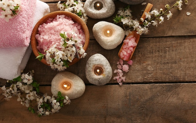 Beautiful spa composition with spring flowers on wooden background