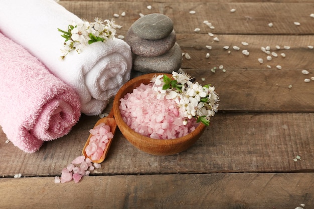 Beautiful spa composition with spring flowers on wooden background