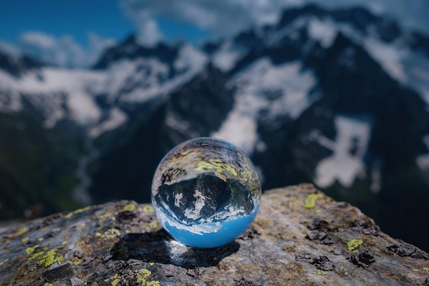 Beautiful spherical glass ball with majestic Caucasian mountains