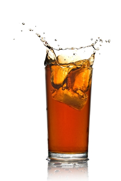 Beautiful splash of cola in glass isolated on white