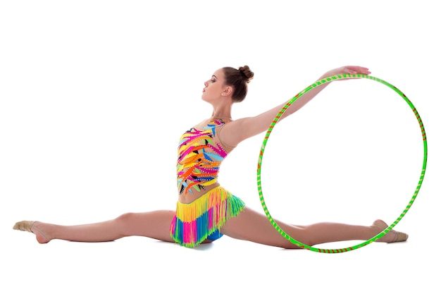 Beautiful sporty woman gymnast posing with hoop isolated on white background