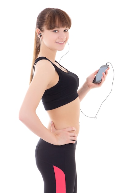 Beautiful sporty woman listening music with phone isolated on white background