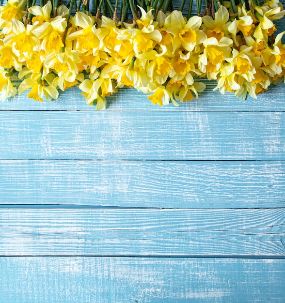 Beautiful spring flowers on a wooden background.