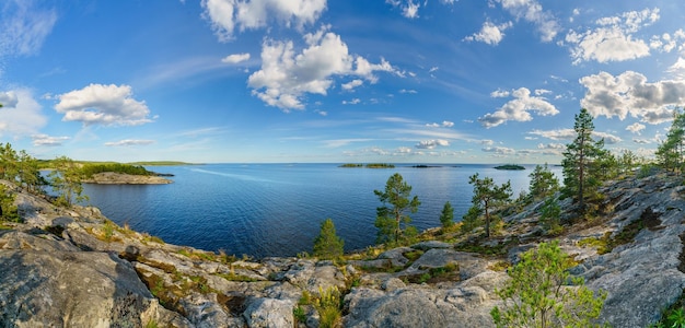 Beautiful stones and pine trees on the lake Landscape of wild nature