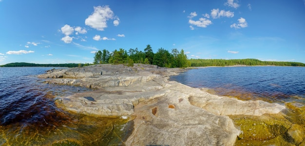 Beautiful stones and pine trees on the lake Landscape of wild nature