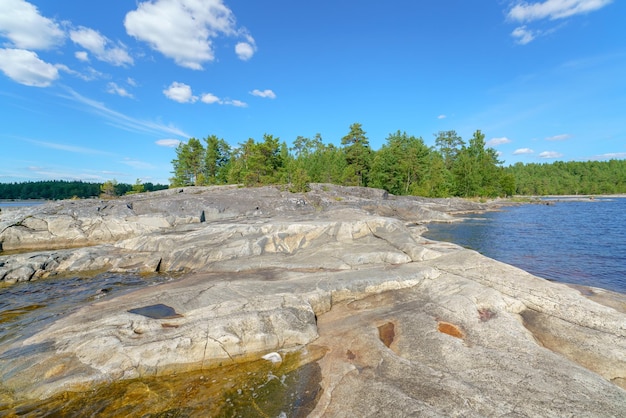 Beautiful stones and pine trees on the lake Landscape of wild nature