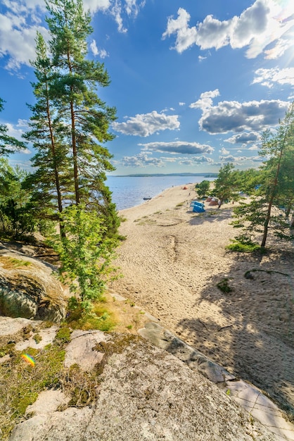 Beautiful stones and pine trees on the lake Landscape of wild nature