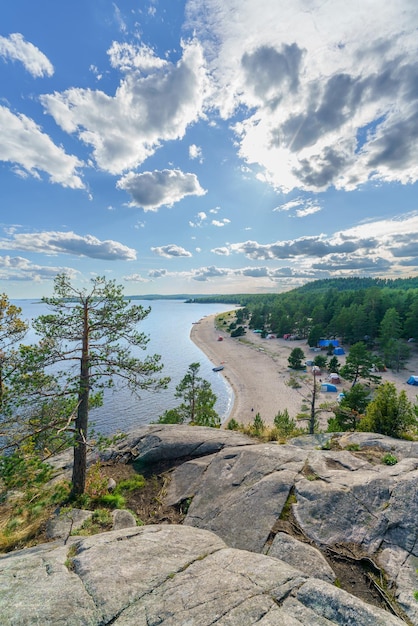 Beautiful stones and pine trees on the lake Landscape of wild nature