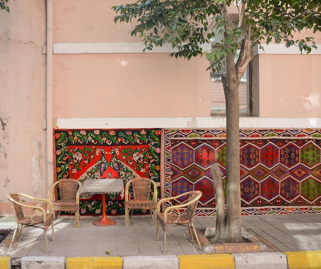 Beautiful street cafe in Turkey with colorful carpets