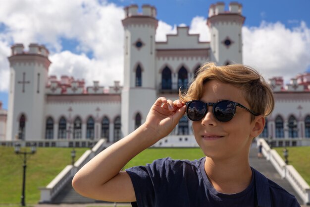 Beautiful stylish 9 years old boy posing with sun glasses