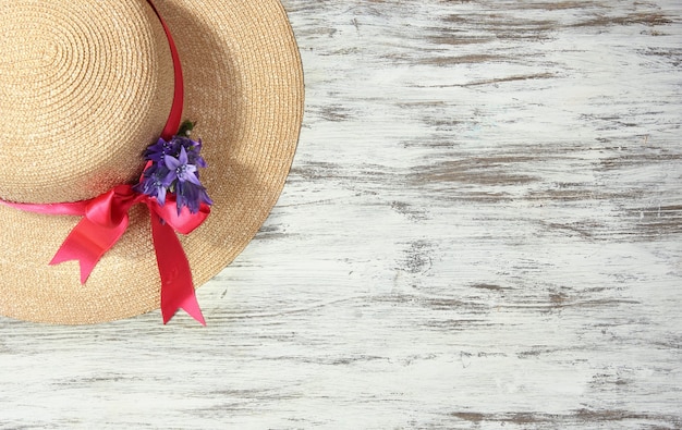 Beautiful summer hat on wooden table