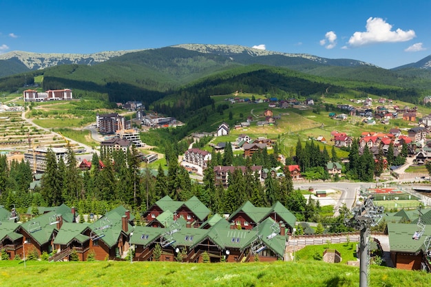 Beautiful summer view of the Carpathians Mountains and hotels in resort Bukovel, Ukraine