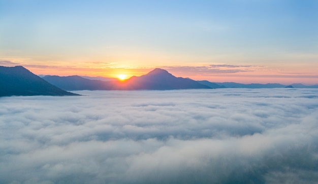 Beautiful sunrise over mountain with fog in the morning