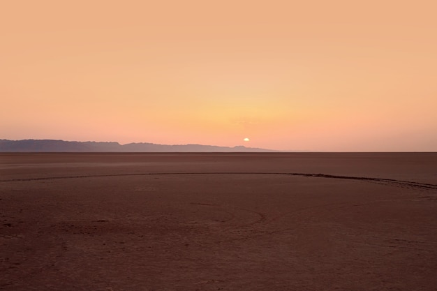 Beautiful sunrise over a salt lake in the Sahara Desert.