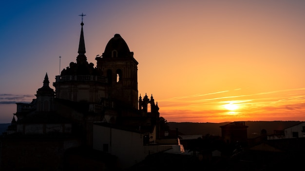 Beautiful sunset. Aerial view of Catholic church located in the Spanish town of Jerez de los Caballeros, belonging to the province of Badajoz, in the autonomous community of Extremadura. Spain