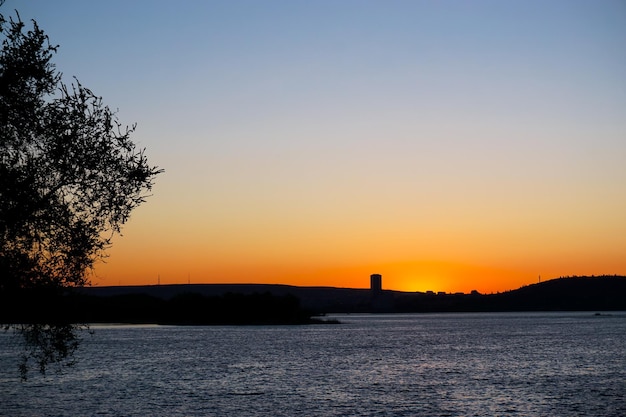 Beautiful sunset on the background of the river