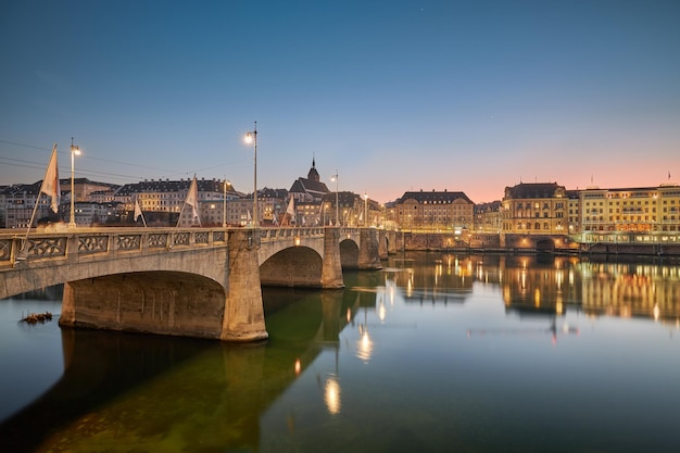 Beautiful sunset on the banks of the Rhine River in the city of Basel Switzerland