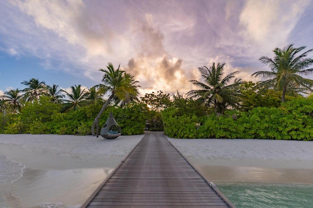 Beautiful sunset beach scene. Colorful sky and clouds view with calm sea and relaxing tropical mood