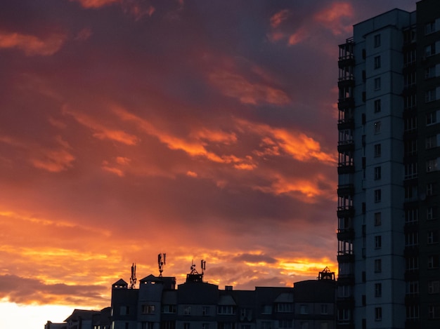 Beautiful sunset over the city Orange sky with clouds