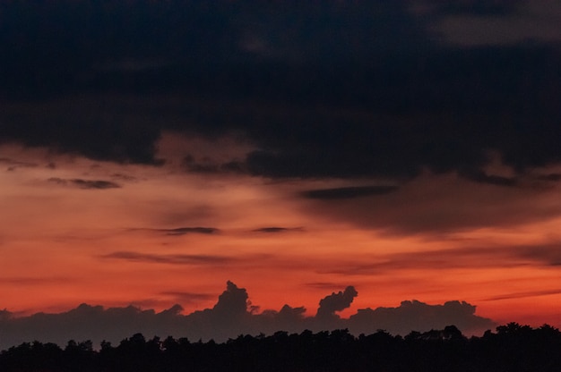 Beautiful sunset dramatic red sky with dark clouds