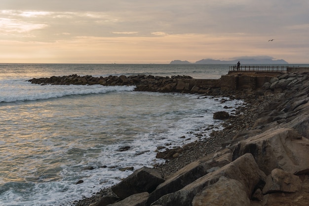 Beautiful sunset in Lima Peru, bright sky and underexposed beach