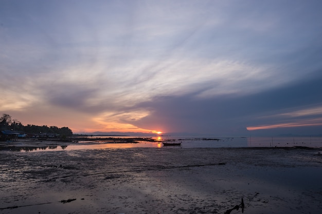 Beautiful sunset during low tide on the beach of Koh Libong village, Trang, Thailand