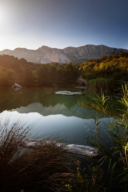 Beautiful sunset on a mountain lake suummer season