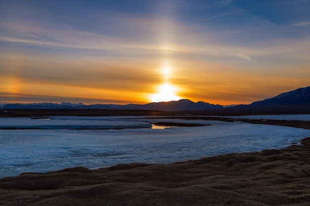 Beautiful sunset in mountains in KoshAgach Altai Republic Russia Bright sun and blue sky