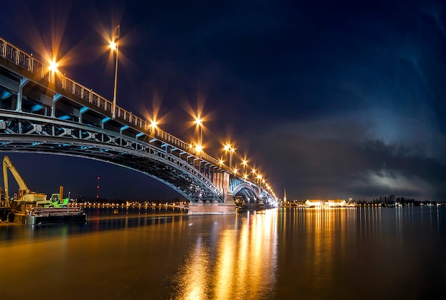 Beautiful sunset night over Rhine / Rhein river and old bridge in Mainz near Frankfurt am Main, Germany.