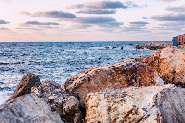 Beautiful sunset at the sea, rocky shore, beautiful landscape