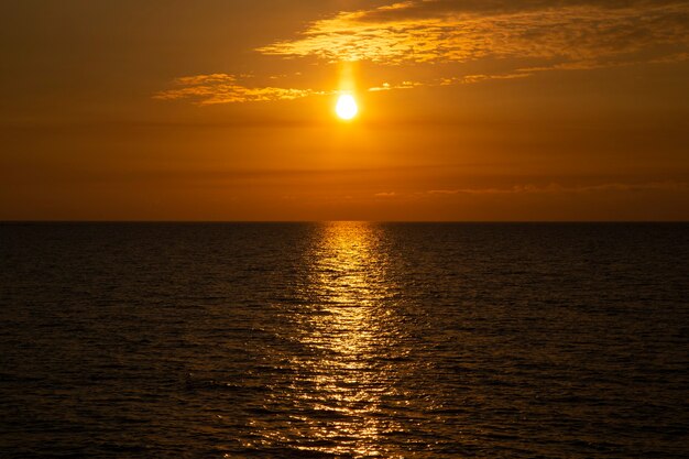 Beautiful sunset above the sea The setting sun over the ocean, in the evening