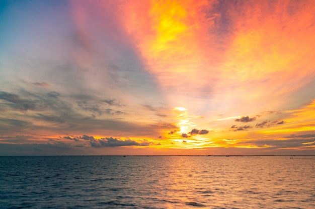 Beautiful sunset sky. Twilight sea and sky. Tropical sea at dusk. Golden sky in the evening.