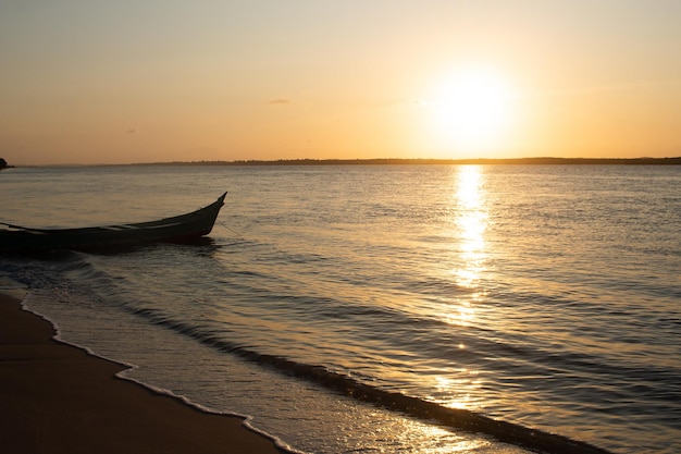 Beautiful sunset with a boat on the river