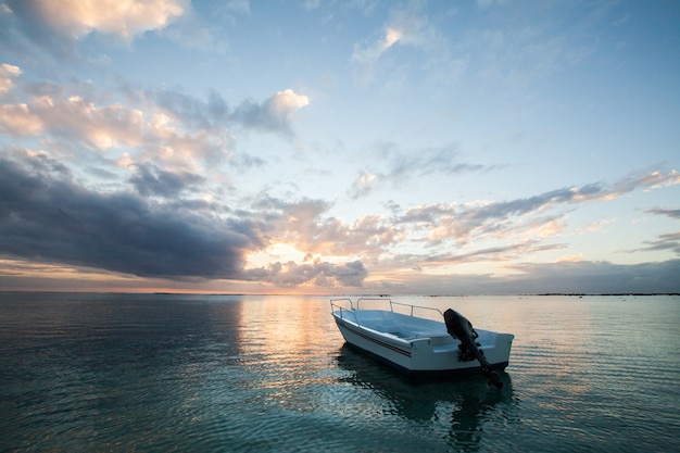 Beautiful sunset with fishing boat