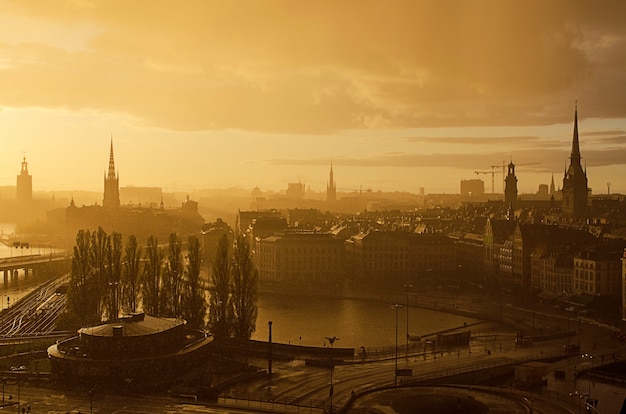 Beautiful sunset with rainbow and dark blue sky over the Stockholm - the capital of Sweden