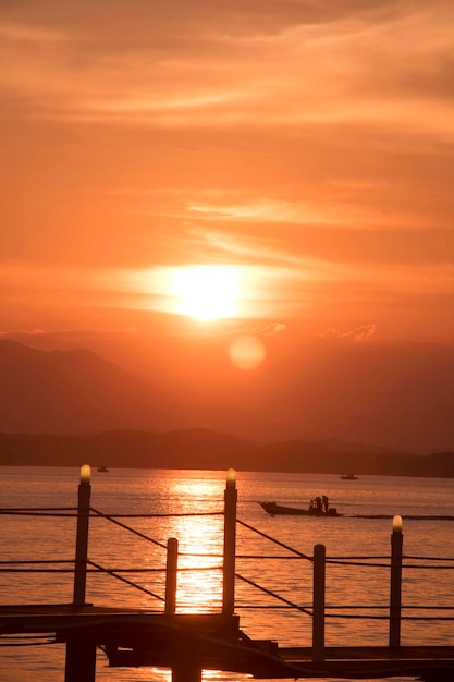 Beautiful sunset with Wooden bridge over the sea in sacheon city Korea