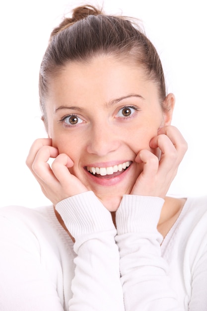 a beautiful surprised woman smiling over white background