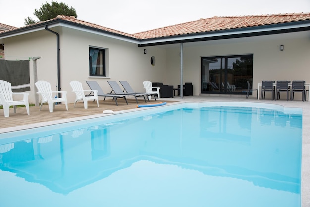 Beautiful swimming pool close to a modern house