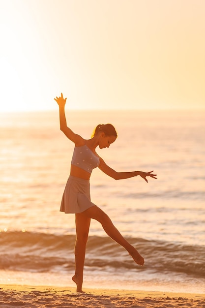 Beautiful teen girl on the beach during summer vacation