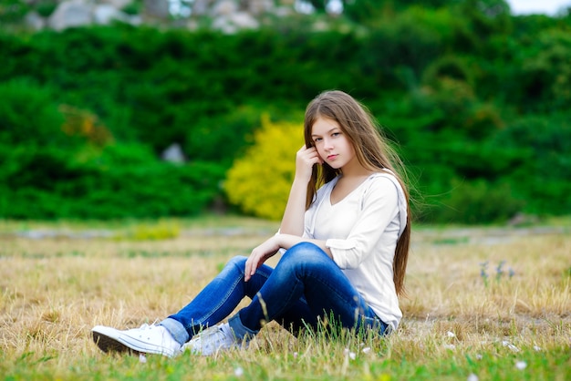 Beautiful teen girl posing in nature