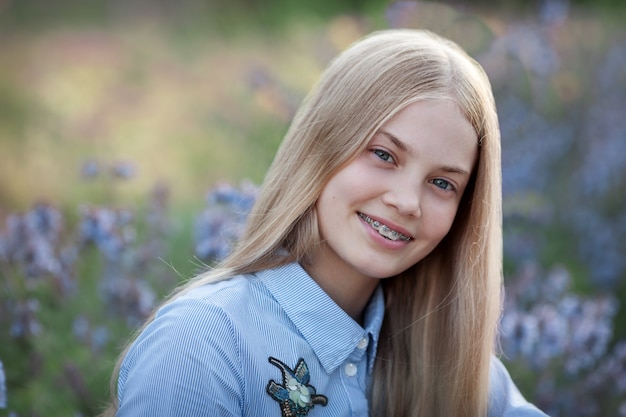 Beautiful teen girl with braces on her teeth smiling