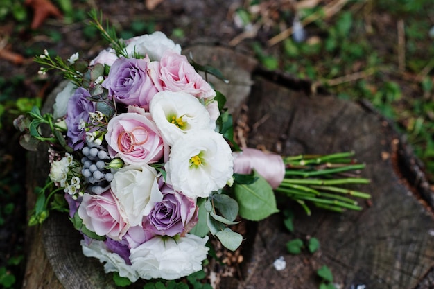 Beautiful tender wedding bouquet and rings