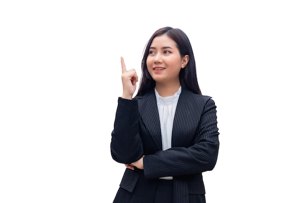 Beautiful Thai Asian woman in a suit is pointing her finger and looking up with white background