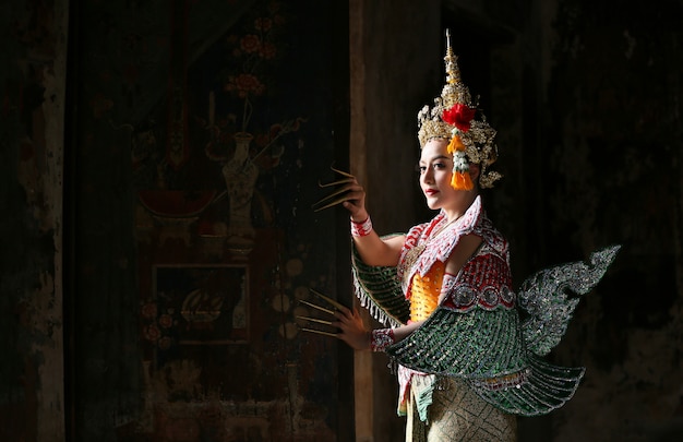 Beautiful Thai young woman portrait in Kinnaree traditional dress costume