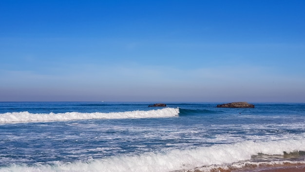 Beautiful tide of the ocean near the mountains