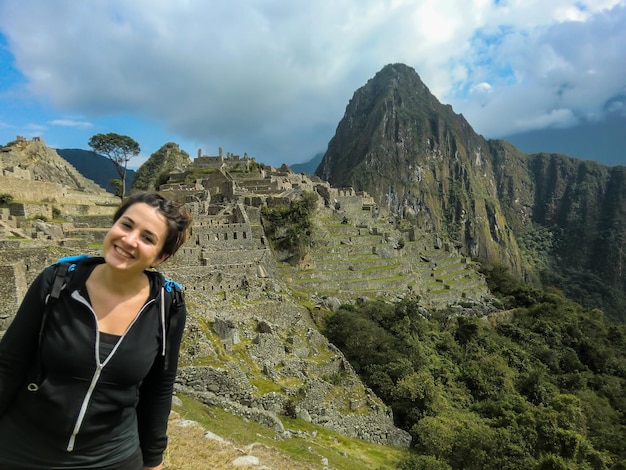 beautiful tourist arriving at the ruins of Machu Picchu, cusco - peru